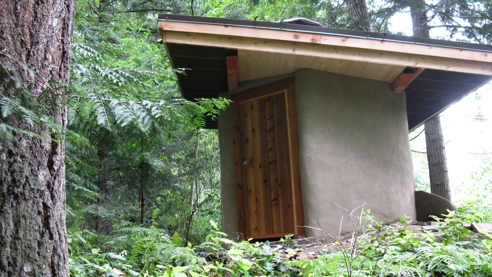 Small structure in the middle of the woods.